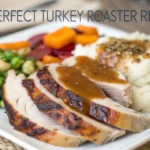 Close-up of juicy turkey slices with crispy skin and rich gravy, served with roasted vegetables.