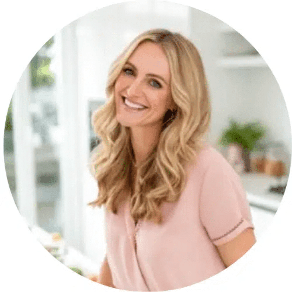 Emma Laurent – Founder and Creative Director of Sena Recipes, smiling in a bright kitchen.