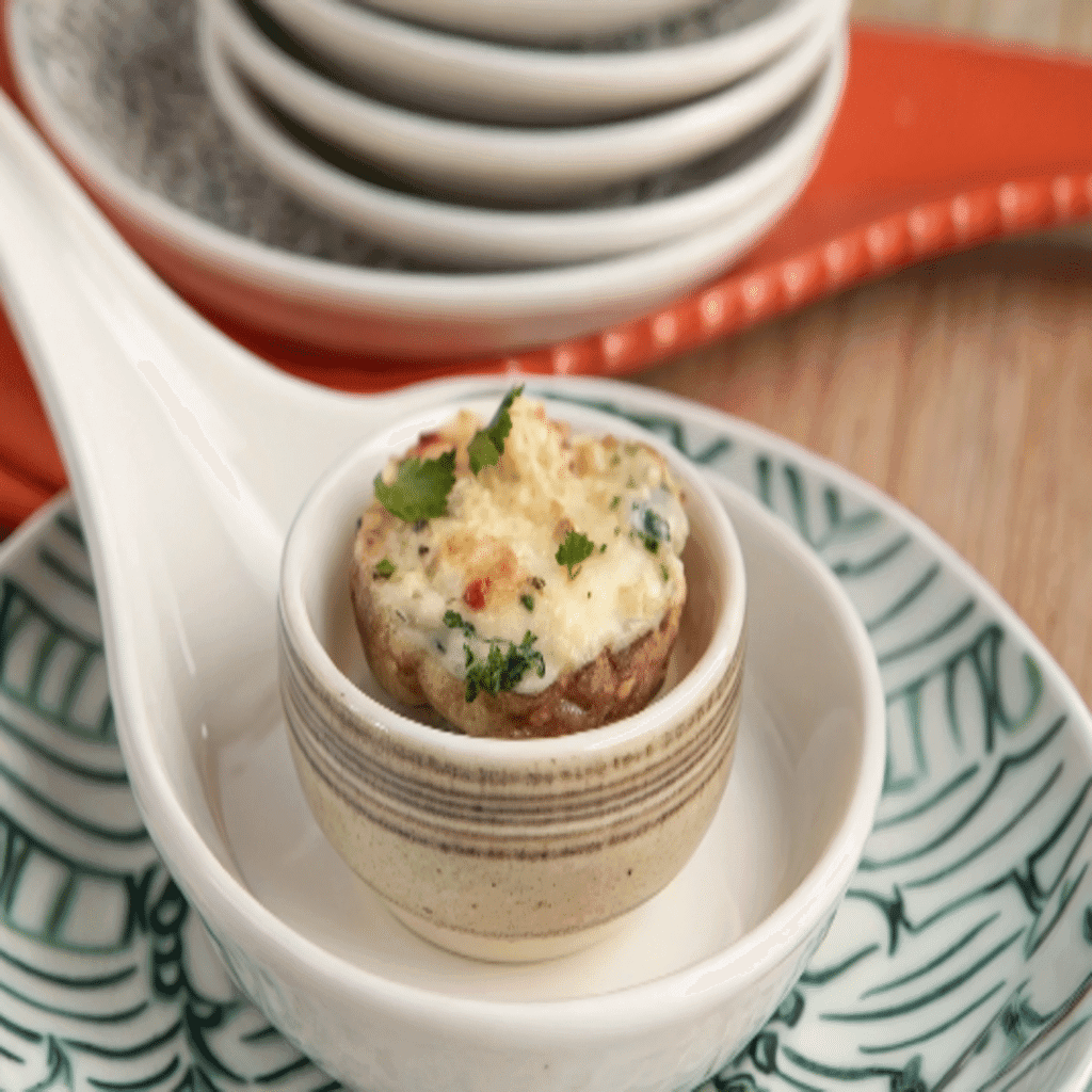 Herb and Cheese Stuffed Mushrooms filled with ricotta, mozzarella, parmesan, and fresh herbs before baking