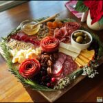 A beautifully arranged Savory Holiday Charcuterie Board featuring meats, cheeses, fruits, nuts, and crackers, garnished with rosemary.