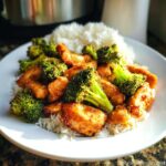 A plate of Air Fryer Chicken Stir-Fry with Broccoli served over white rice.