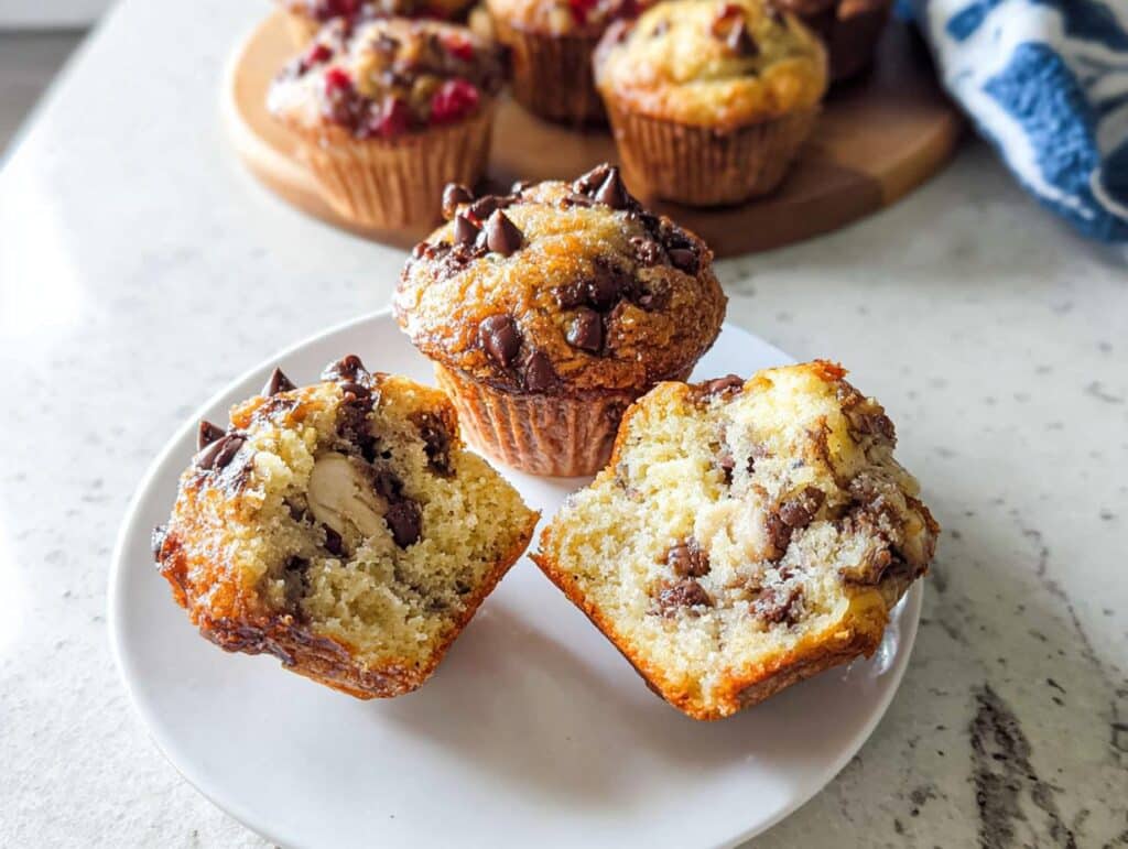 Close-up of a chocolate chip Banana Pancake Mix Muffins cut in half showing moist interior and chocolate chips.
