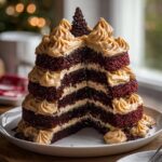 Cross-section view of the multi-layered Peanut Butter Chocolate Bliss Cake with rich dark layers and peanut butter frosting.