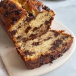 Close-up of a slice of Thermomix Chocolate Chip Banana Bread showing moist texture and melted chocolate chunks.