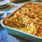 Close-up of a baked Chicken Tenderloin Stuffing Casserole with a crispy, golden stuffing topping.