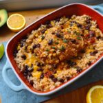 Close-up of Santa Fe Chicken & Rice baked in a dish with black beans, corn, and melted cheese.